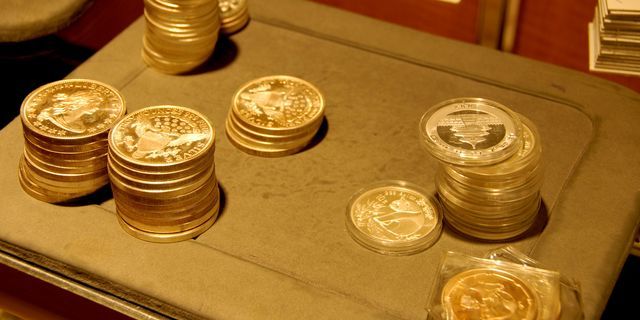 Gold slides in Asia on stronger greenback