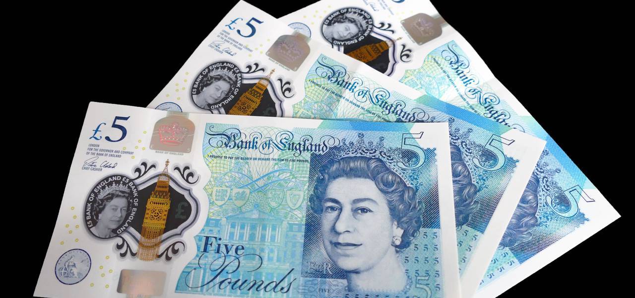 British pound inches up as UK surge is revised up 