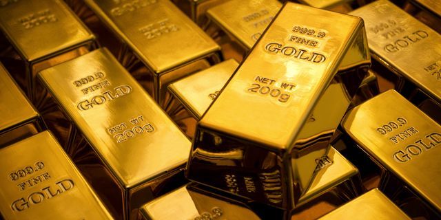 Gold moves down on stronger greenback