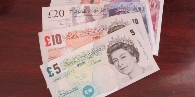 British pound slumps after mixed UK data