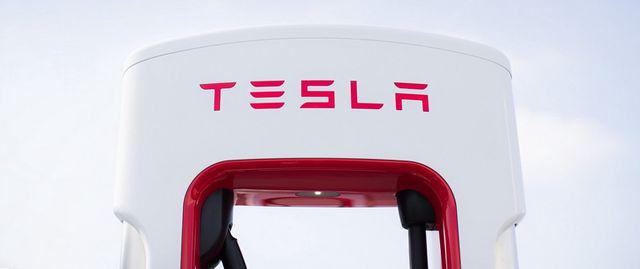 Tesla leads Nasdaq to record highs