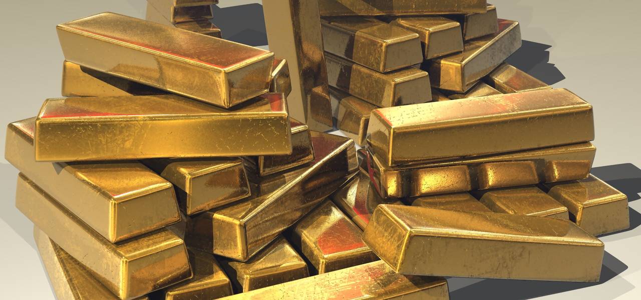 Gold inches up as healthcare vote delay weighs on greenback 