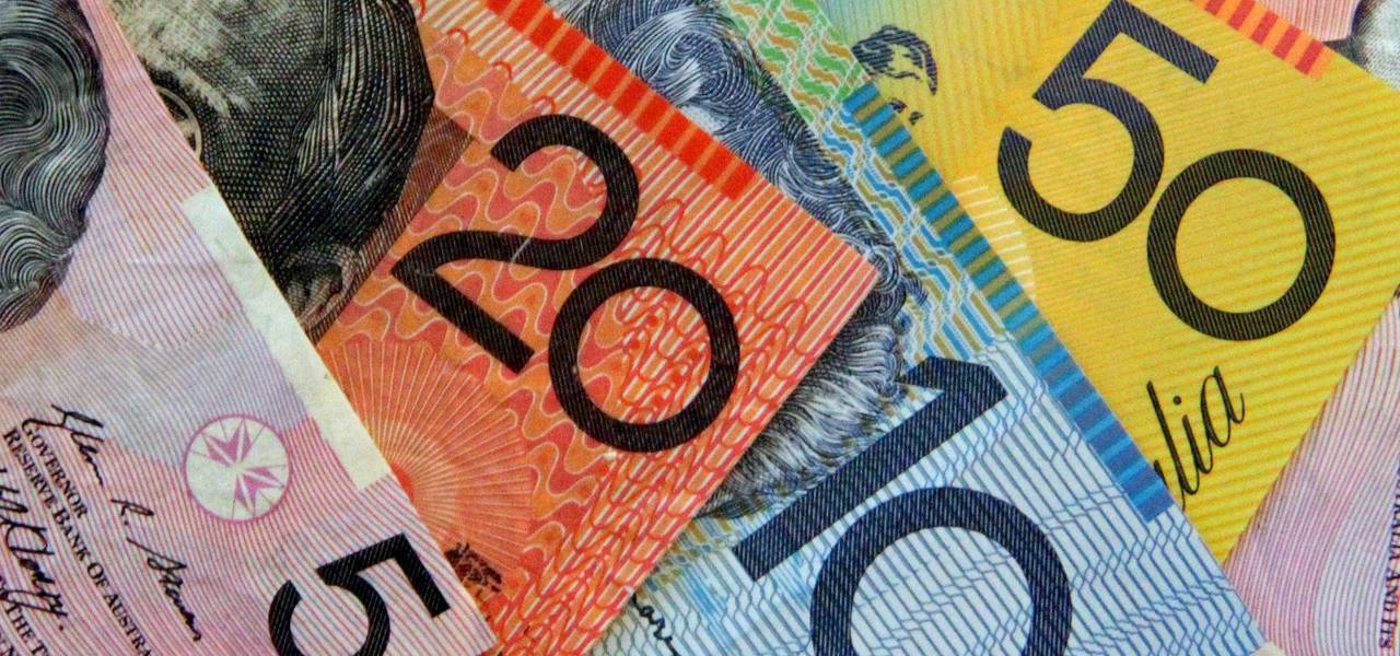 Australian dollar slides after key bank holds steady as expected